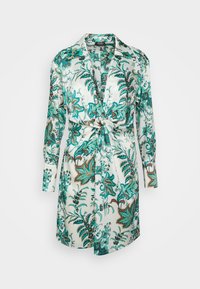 Sukienka z satynowej bluzki w kwiatowy i liściasty wzór w kolorze teal, brązowym i białym. Posiada związany w pasie krój oraz długie rękawy z kołnierzykiem.