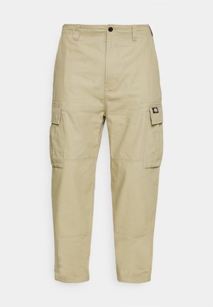 Beige cargo pants made of durable fabric, featuring two side pockets, a button closure, and tapered legs with a smooth texture.