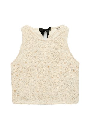 Lace crop top in off-white, featuring circular patterns and a black bow accent at the neck. Textured, sleeveless design.