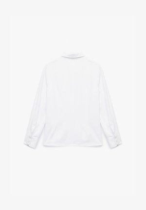 Valkea pitkähihaisena paita, joka on valmistettu sileästä kankaasta, jossa on kaulus ja napitettu hihansuu, puhdas, minimalistinen muotoilu ilman kuvioita.