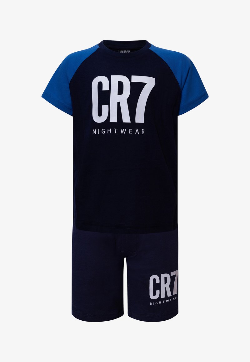 Ensemble enfant avec haut à manches courtes bleu marine et bleu et short, avec l'inscription "CR7 Nightwear" imprimée en blanc sur les deux pièces.