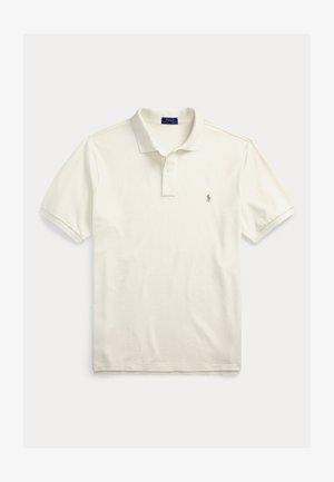 Īsroku polo krekls no krēmkrāsas kokvilnas. Tam ir klasiskas apkaklītes apkakle, divu pogu aizdare un neliels izšūts logo kreisajā krūtīs.