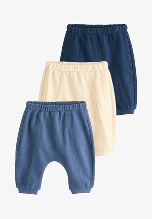 Drei Paar Kinderhosen: eine dunkelblaue, eine hellbeige und eine mittelblaue. Alle verfügen über elastische Bündchen und schmal zulaufende Beine.