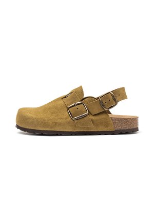 Brown suede clog with adjustable metal buckles, open back strap, and cork sole.