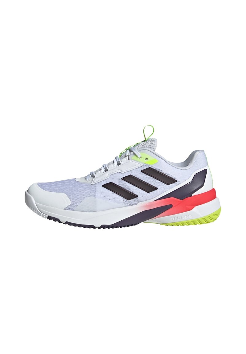 Buty sportowe z białą siateczką na górze, czarnymi paskami i neonowymi zielonymi akcentami. Zawierają wielokolorową podeszwę z czerwonymi i różowymi detalami.