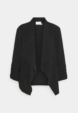Cardigan noir pour femme à ouverture frontale avec revers drapés et manches trois-quarts froncées sur fond blanc.