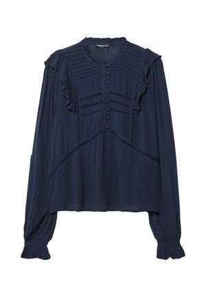 Blouse longue à manches en bleu marine avec un col rond, des accents volantés, des plis verticaux et des fermetures à boutons sur le devant. Texture de tissu douce.