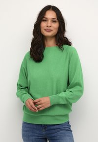 Groene pullovertrui van zachte brei stof, met een ronde hals, lange mouwen, geribbelde manchetten en zoom, en een relaxed fit.