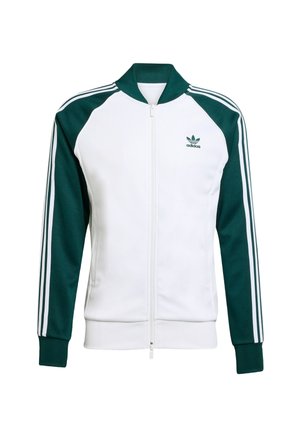 Giacca Adidas con una parte anteriore bianca e maniche verde scuro. Presenta chiusura con zip, colletto a costine, polsini e tre strisce bianche sulle maniche.