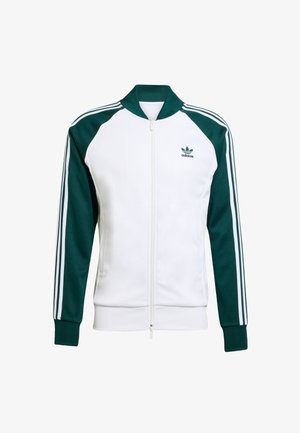Adidas-jack met een witte voorkant en donkergroene mouwen. Voorzien van een ritssluiting, geribbelde kraag, manchetten en drie witte strepen op de mouwen.