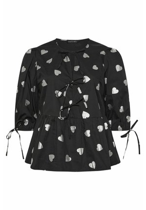 Mustapaita, jossa on hopeinen sydänkuvio, pyöreä pääntie, etutähystimet ja puffihihat, joissa on säädettävät soljet hihansuissa.