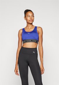 Puma KEEPS BRA - Sport-BH mit mittlerer Stützkraft - lapis lazuli