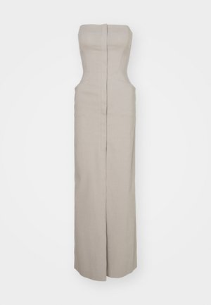 Ilmaõlapaeltega beež linane kleit, millel on vormitud rinnaosa ja sirge, pikk seelik. Omab seljaosa peidetud lukku ja külgõmblusi.