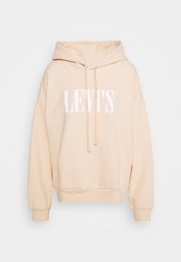 Felpa beige con cappuccio, dotata di tasca a marsupio, cordino e grande logo bianco "LEVI'S" stampato sulla parte anteriore. Tessuto morbido con polsini a costine.