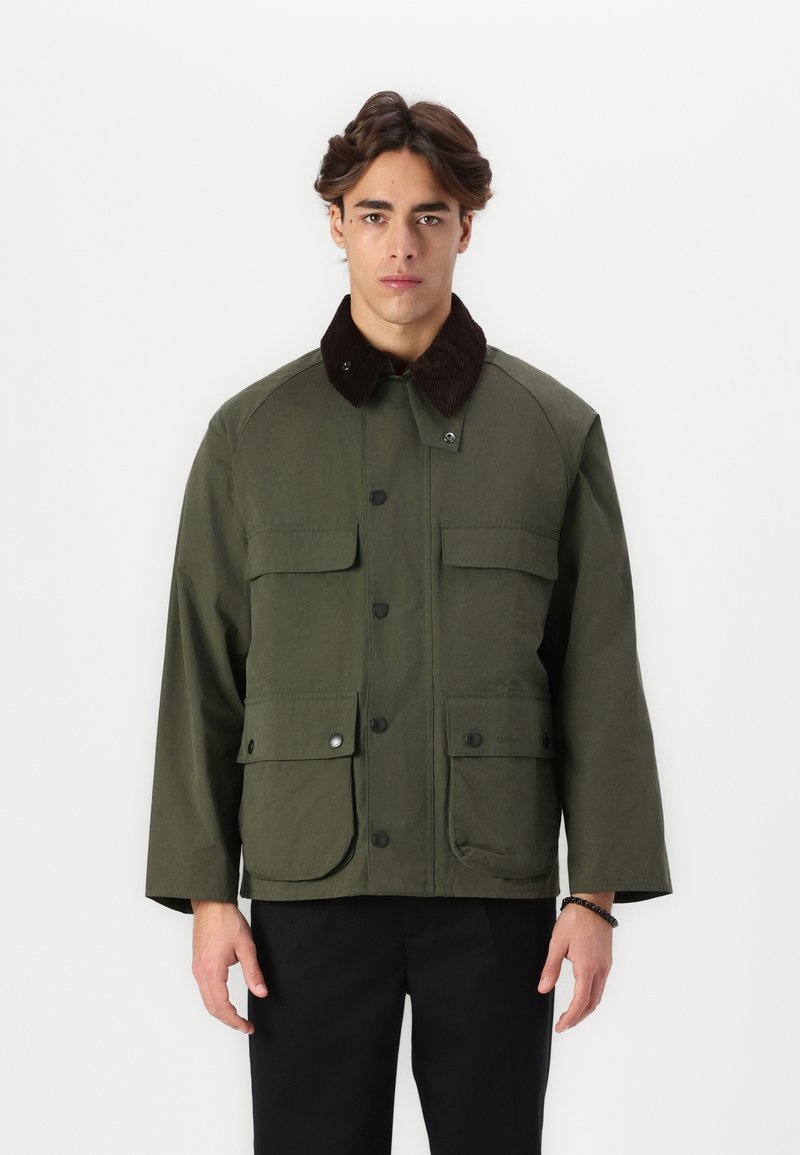 Olive green jacket with a brown corduroy collar, multiple front pockets, button closures, and a slightly loose fit.