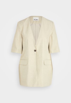 Svetlo béžový blazer s krátkymi rukávmi a hlbokým V-výstrihom. Má jediné gombíkové zapínanie a dve predné vrecká, textúrovaná tkanina.