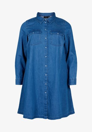 Denimmekko, jossa on kaulus, pitkät hihat, kaksi rintataskua ja napitettava etuosa. Väri on keskisininen ja pinta on sileä.