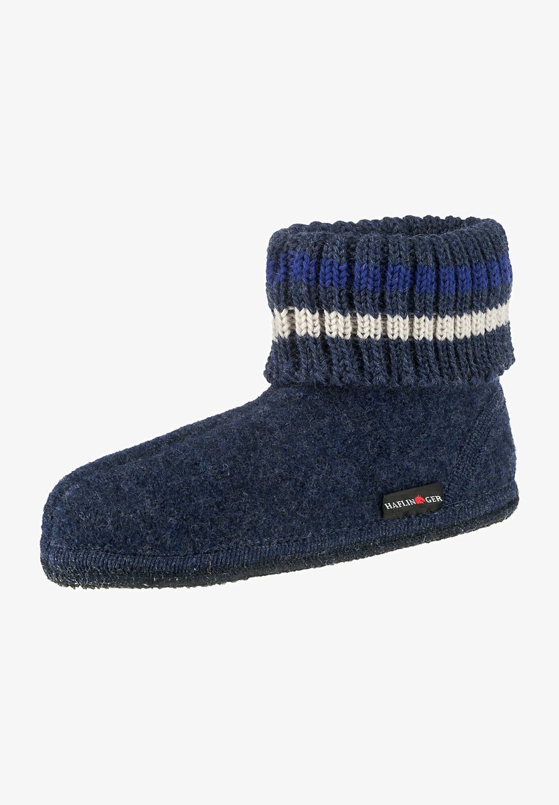 Navy wool slipper with a knitted cuff featuring blue, white, and dark blue stripes. Soft texture with a flat sole and logo tag on the side.