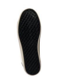 Suela de zapato de goma con un patrón hexagonal negro, con un borde blanquecino. Diseñada para tracción y flexibilidad.