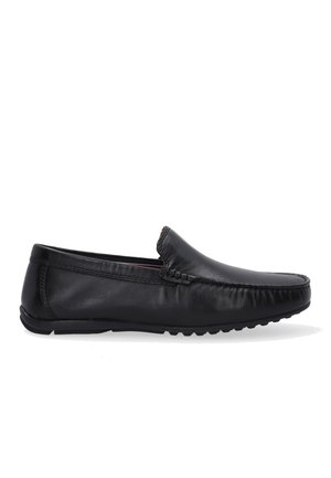 Black leather slip-on shoe with a rounded toe, smooth texture, and decorative stitching along the front. Rubber sole with grip pattern.