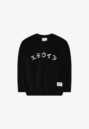 Felpa nera con collo a giro, caratterizzata da scritte bianche in un font stilizzato sulla parte anteriore e un'etichetta all'orlo. Texture liscia.