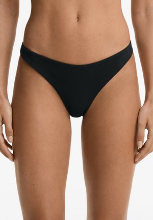 Black bikini bottom with a ribbed texture, low-rise design, and narrow side straps. Features minimal coverage and streamlined shape.