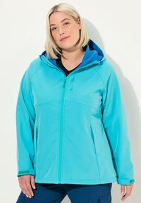 Turkos dragkedja jacka med huva, som har en kontrasterande blå foder, sidofickor och textilstruktur för komfort och värme.