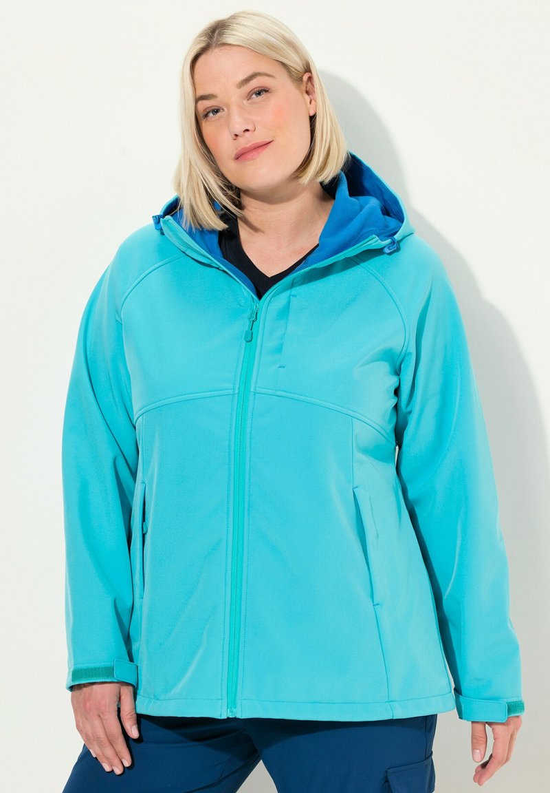 Turkos dragkedja jacka med huva, som har en kontrasterande blå foder, sidofickor och textilstruktur för komfort och värme.