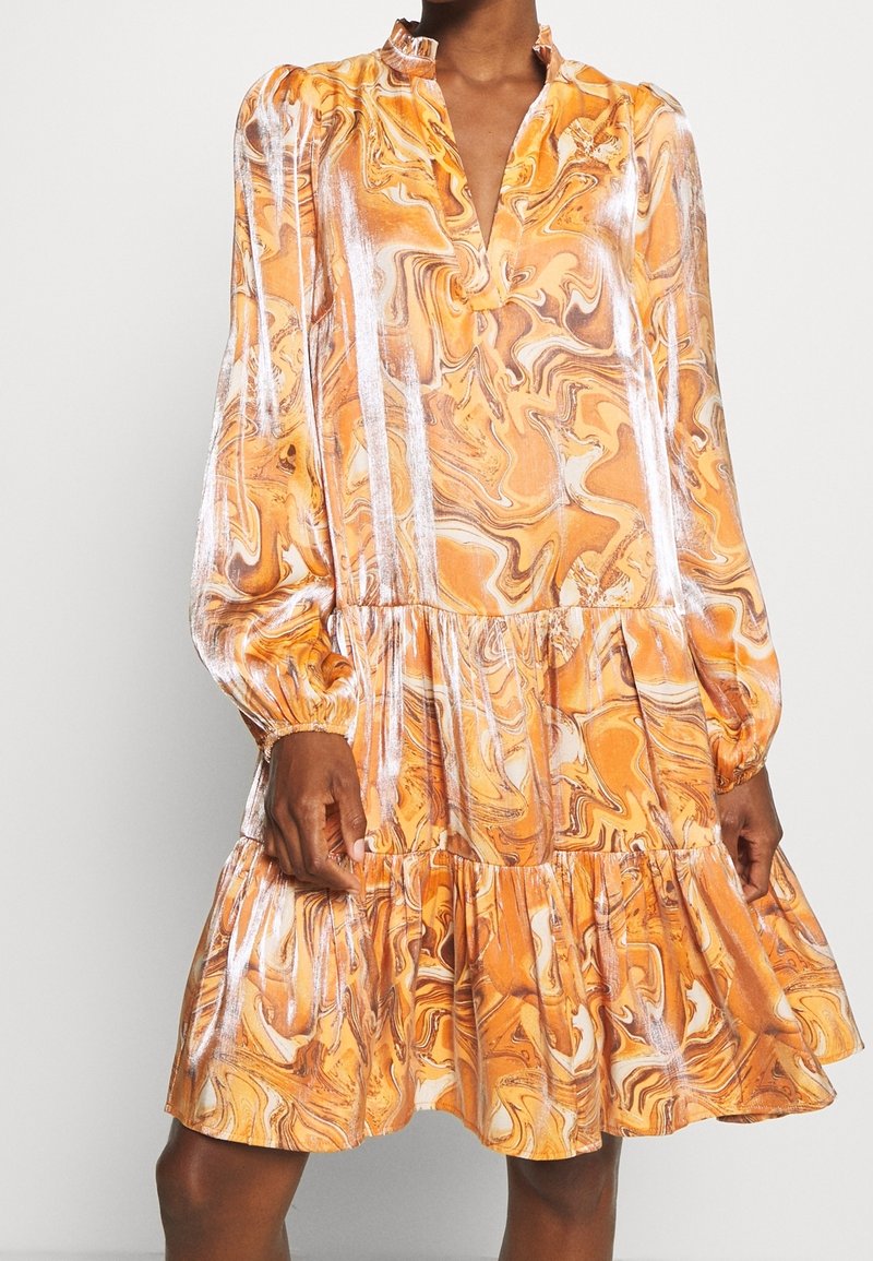 Orange marble-patterned dress with a V-neck and long puff sleeves. The design features a tiered hem and a smooth, flowing texture.