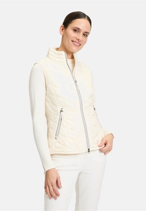 White quilted sleeveless vest with a high collar, front zipper, and two zippered side pockets. Smooth texture with a subtle sheen.