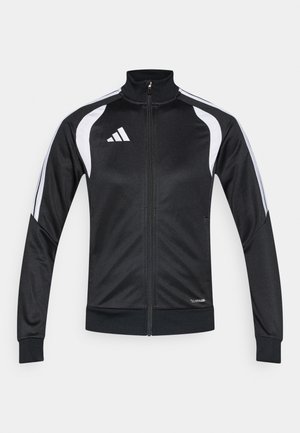 Μαύρο φόρεμα με φερμουάρ και λευκές λεπτομέρειες και ρίγες, κατασκευασμένο από απαλό ύφασμα, με ψηλό γιακά και ελαστικές μανσέτες.