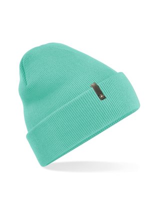 Turquoise knit beanie hat with a ribbed texture and a folded cuff, featuring a small metallic tag on the side. Lightweight and flexible design.