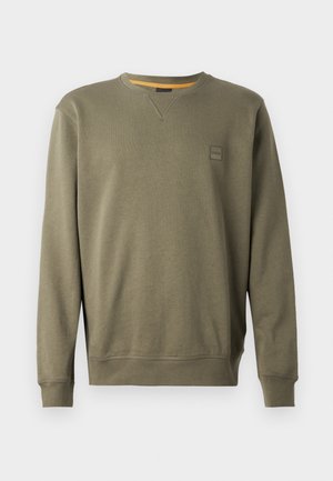 Sweatshirt vert olive en mélange de coton doux, avec un col rond, des poignets côtelés et un petit logo brodé sur la poitrine.