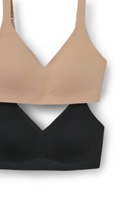 Due reggiseni esposti insieme: uno beige con una texture liscia e scollatura a V profonda, l'altro nero con un design e una forma simili.