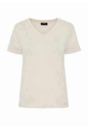 Kremowa koszulka z dekoltem w kształcie litery V i krótkimi, podwiniętymi rękawami, wykonana z miękkiego materiału. Posiada małą metkę marki na dolnej prawej stronie.