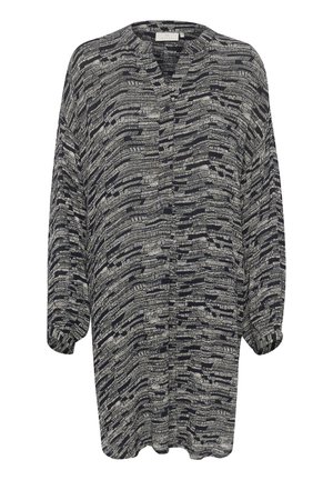 Kortärmad, knäppblus i marinblått med vitt abstrakt mönster. Mjuk, lättviktsmaterial med avslappnad passform och plisserad design.