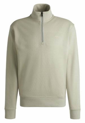 Light beige zip-neck sweatshirt, made of textured fabric, with ribbed cuffs and hem, featuring a small logo on the chest.