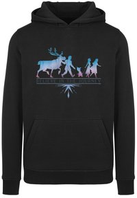 Felpa nera con cappuccio caratterizzata da un design grafico con silhouette di un renna e figure; la scritta recita "CREDI NEL VIAGGIO", con accenti blu e rosa.