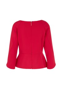 Rotes Peplum-Oberteil aus glattem Stoff, mit hohem Kragen, drei Viertel Ärmeln und einem Reißverschluss auf der Rückseite. Saubere Linien und taillierte Passform.