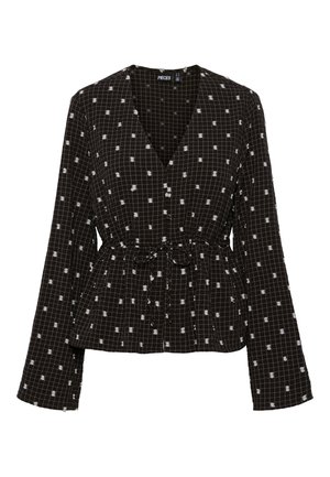 Black and white checkered wrap top with long sleeves, tie waist, and scattered white dot pattern. Made from lightweight fabric with a soft texture.