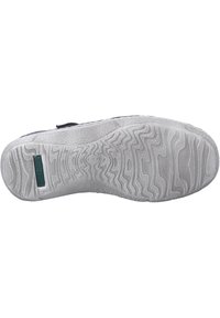 Shoe sole with textured rubber material; features zigzag tread pattern, reinforced heel, and a small green branding accent.