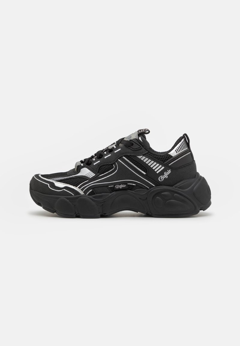 Black athletic sneakers with mesh and textile upper, reflective silver accents, thick rubber sole, and prominent cushioning detail.