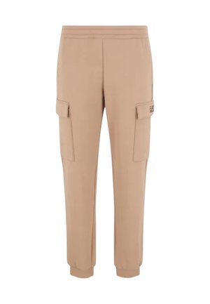 Pantalons cargo beiges en tissu doux, dotés de poches cargo latérales, de poignets élastiques et d'une taille ajustée. Design minimaliste avec des lignes épurées.