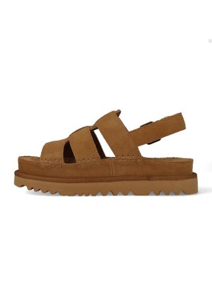 Brown suede sandal with three front straps, a back strap with buckle, and a thick, ridged rubber sole.