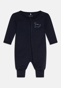 Mørkeblå langermet bodysuit i bomull med glidelås foran, med en hvit dinosaurgrafikk på brystet og ribbestrikkede ermer og ankler.