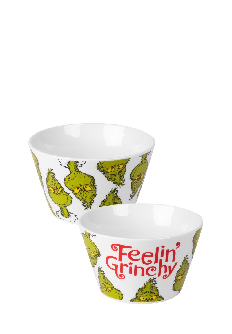 Ciotole in ceramica bianca con volti di Grinch stilizzati e verdi, con la scritta "Feelin' Grinchy" in bold rosso, finitura liscia e forma bassa.