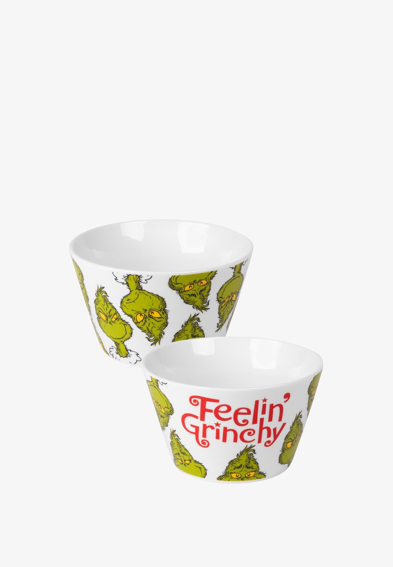 Ciotole in ceramica bianca con volti di Grinch stilizzati e verdi, con la scritta "Feelin' Grinchy" in bold rosso, finitura liscia e forma bassa.