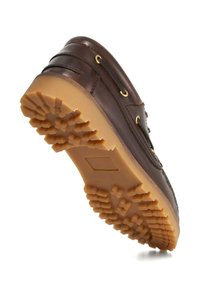 Brown leather shoe with a gum rubber sole, featuring a textured grip, metal eyelets, and contrasting stitching.