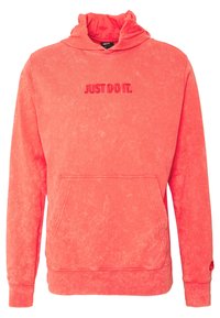 Felpa corallo con cappuccio regolabile, tasca frontale e scritta in rilievo "JUST DO IT." realizzata in un morbido tessuto testurizzato.