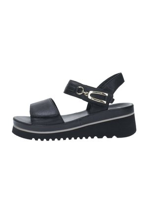 Black platform sandals featuring a smooth leather upper, adjustable strap with metallic buckle, and ridged rubber sole.
